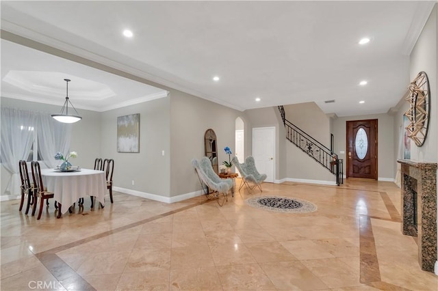 entrance foyer featuring crown molding