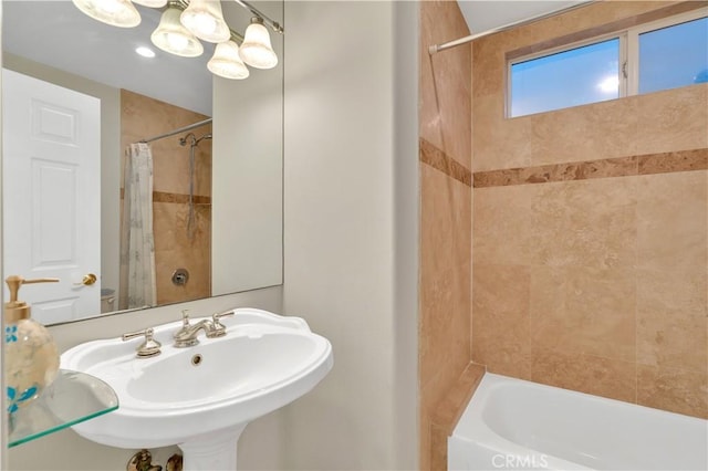 full bathroom featuring sink, toilet, and shower / bath combo with shower curtain