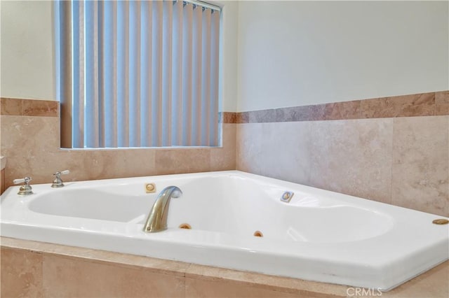 bathroom featuring a relaxing tiled tub