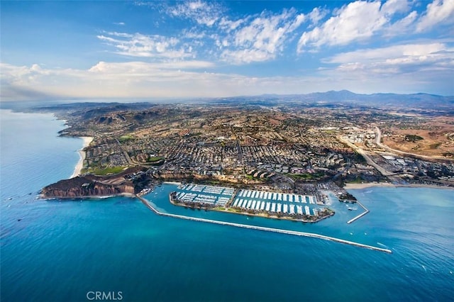 aerial view featuring a water and mountain view