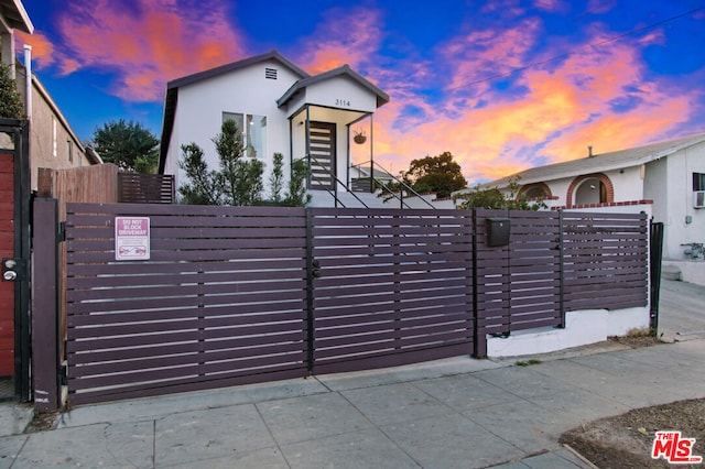 view of gate at dusk