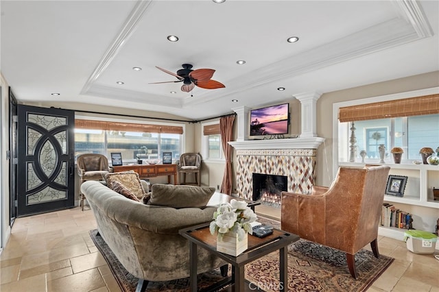 150 Cress St, Laguna Beach, CA 92651 - living room with a warm lit fireplace, ornamental molding, ceiling fan, a tray ceiling, and recessed lighting