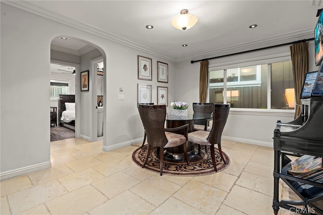 150 Cress St, Laguna Beach, CA 92651 - dining area with baseboards, arched walkways, stone tile floors, and ornamental molding