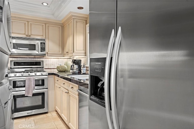 150 Cress St, Laguna Beach, CA 92651 - kitchen with tasteful backsplash, cream cabinets, crown molding, dark countertops, and appliances with stainless steel finishes