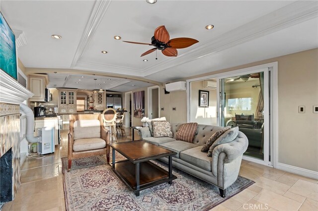 150 Cress St, Laguna Beach, CA 92651 - living area with a raised ceiling, a wall mounted air conditioner, ornamental molding, a ceiling fan, and a high end fireplace