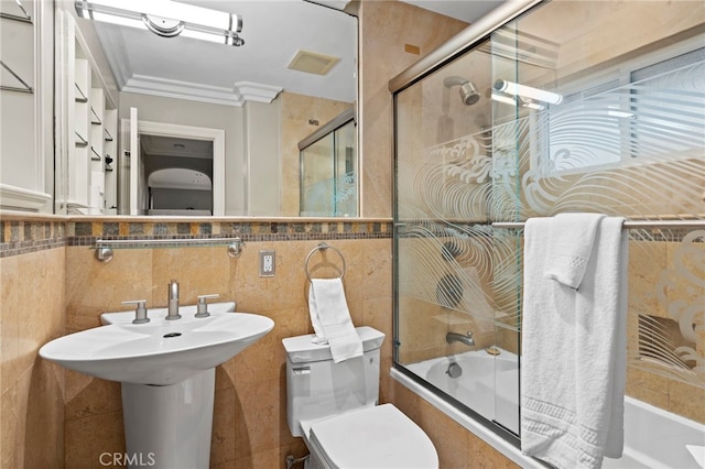 150 Cress St, Laguna Beach, CA 92651 - bathroom with ornamental molding, tiled shower / bath combo, tile walls, and toilet