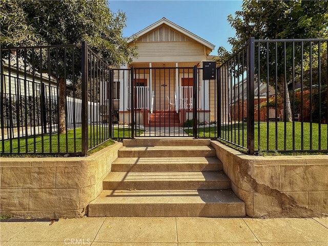 view of gate featuring a yard