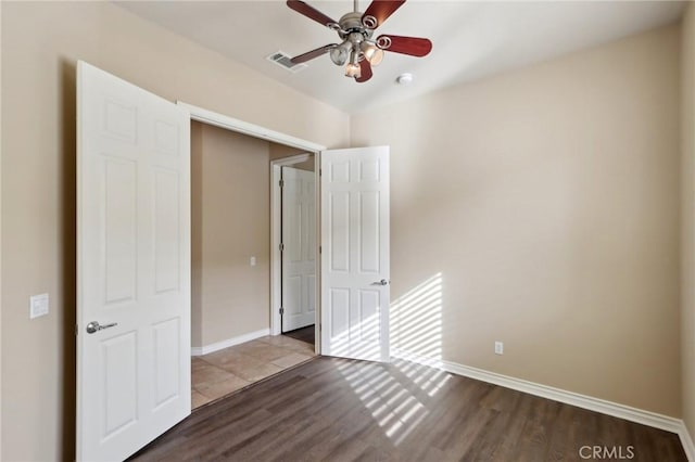 unfurnished bedroom featuring ceiling fan and light hardwood / wood-style floors