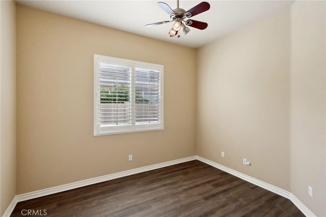 unfurnished room featuring dark hardwood / wood-style floors and ceiling fan