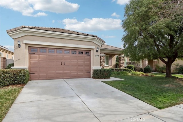 view of front of property with a garage and a front lawn