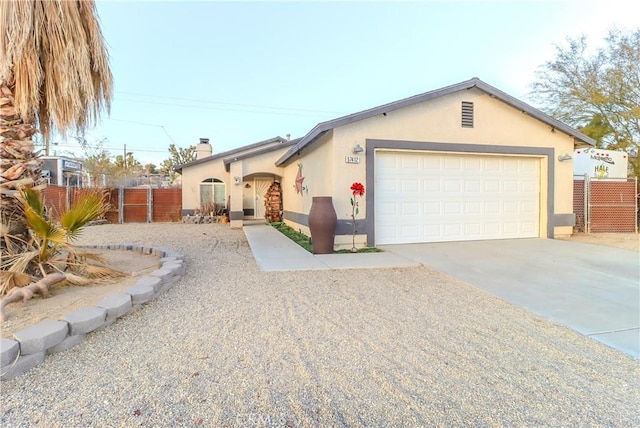 ranch-style home featuring a garage