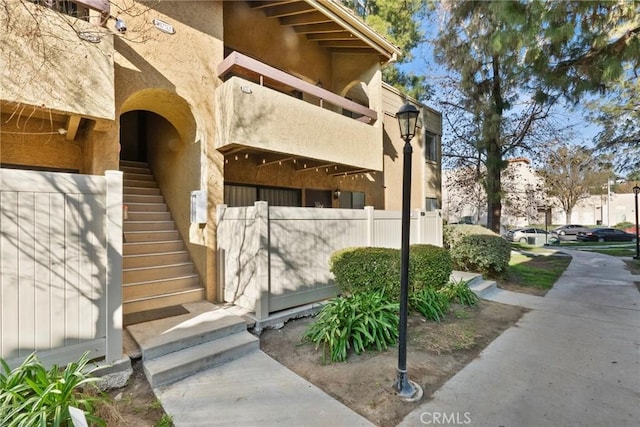 property entrance with a balcony