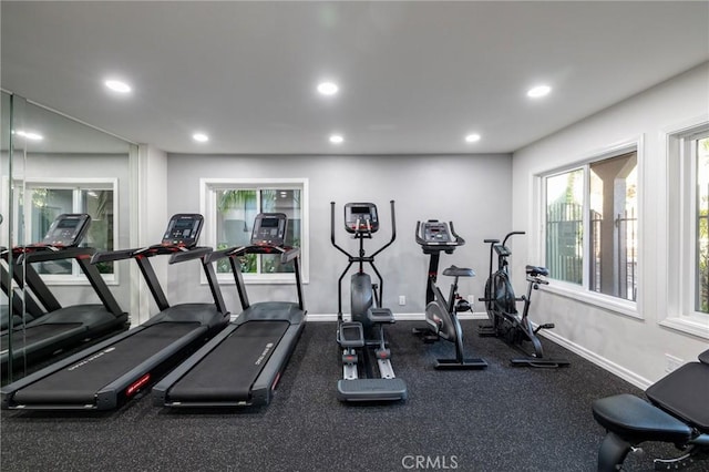 workout area with recessed lighting and baseboards