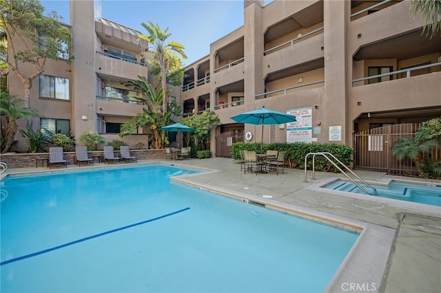 community pool with a patio area