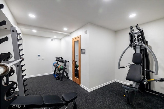 exercise room with recessed lighting, visible vents, and baseboards