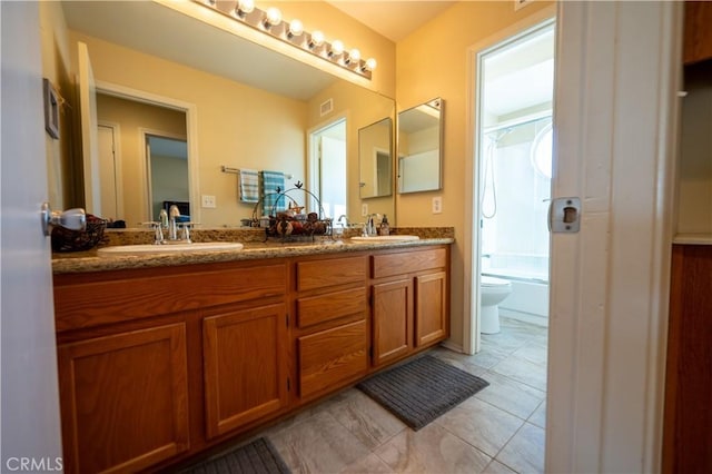 full bathroom with tile patterned flooring, vanity, bathtub / shower combination, and toilet