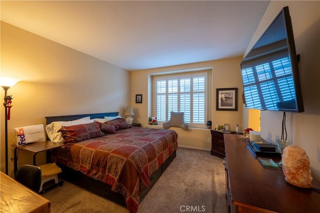 bedroom featuring carpet