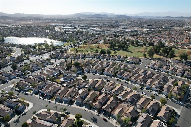 aerial view featuring a water and mountain view