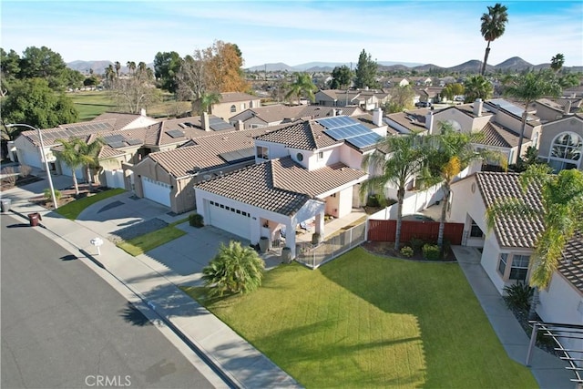 birds eye view of property with a mountain view