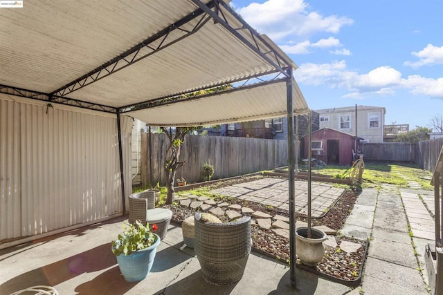 view of patio / terrace featuring a storage unit