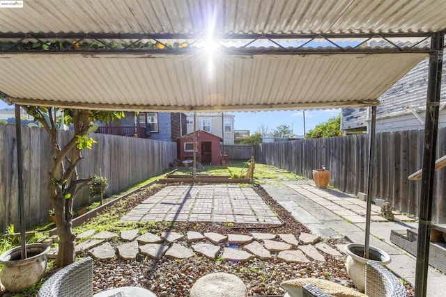 view of patio / terrace with a shed