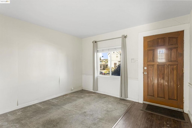 view of carpeted entrance foyer