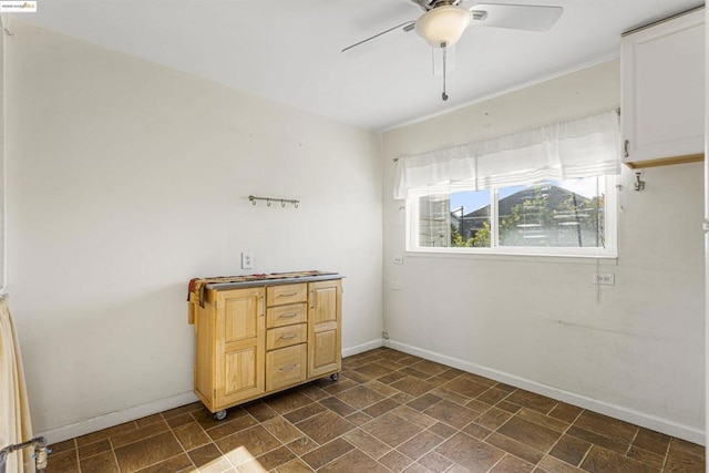 interior space featuring ceiling fan