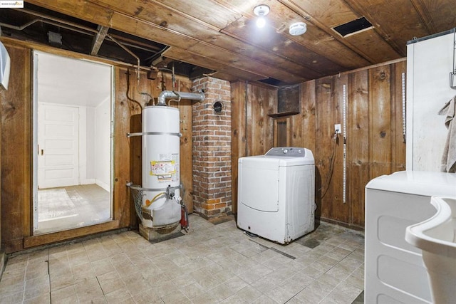 laundry room featuring wood ceiling, secured water heater, wood walls, and washer / clothes dryer