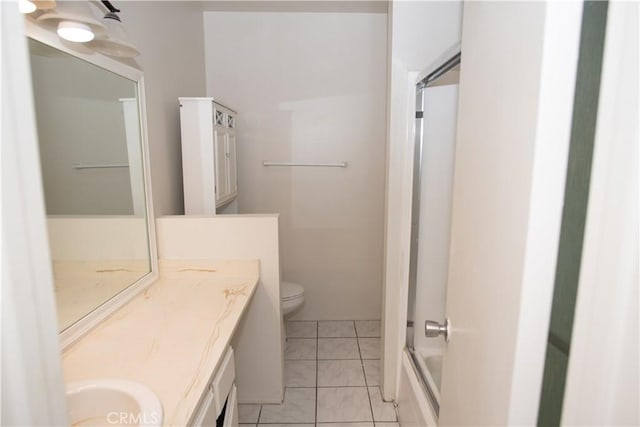 full bath with toilet, tile patterned flooring, and vanity