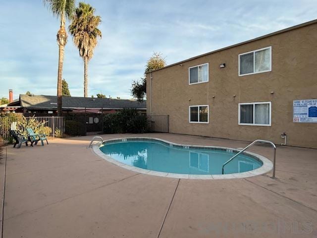 view of swimming pool featuring a patio