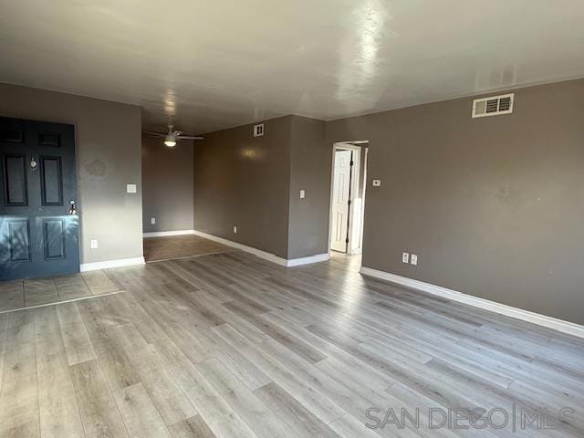 unfurnished living room with light hardwood / wood-style flooring and ceiling fan