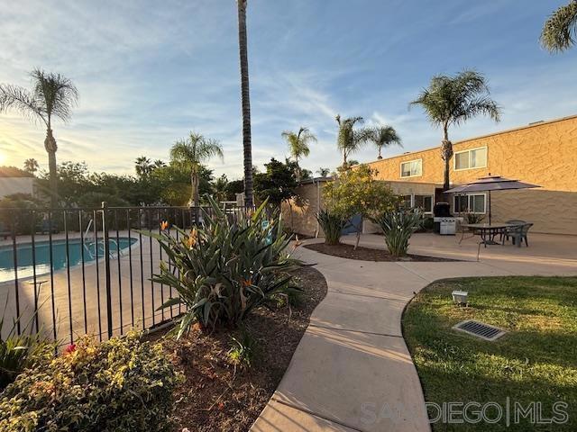 view of property's community with a patio and a swimming pool