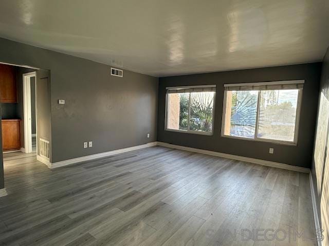 spare room featuring hardwood / wood-style flooring