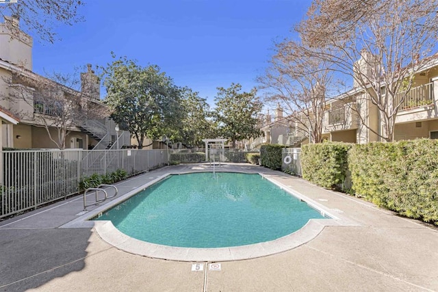 view of swimming pool featuring a patio