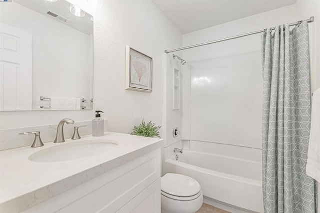 full bathroom featuring toilet, shower / bath combination with curtain, and vanity