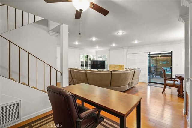 dining space featuring ceiling fan, crown molding, and light hardwood / wood-style floors