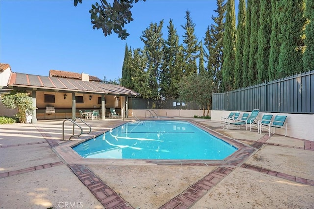 view of swimming pool featuring a patio