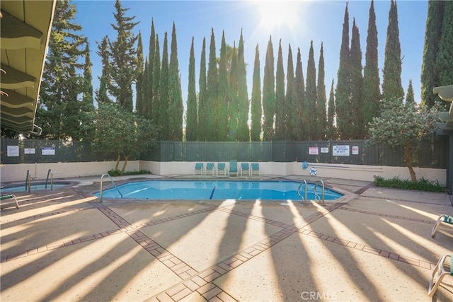 view of swimming pool with a patio area