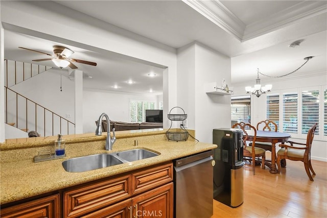 kitchen featuring sink, light hardwood / wood-style flooring, plenty of natural light, and stainless steel dishwasher