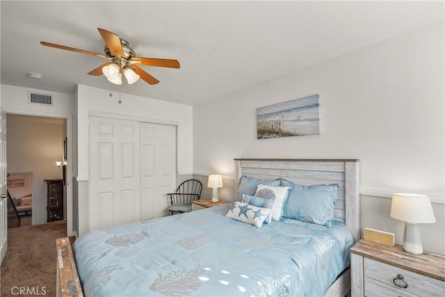 carpeted bedroom featuring a closet and ceiling fan