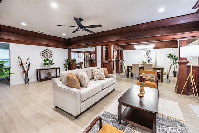 living room with light hardwood / wood-style floors and ceiling fan