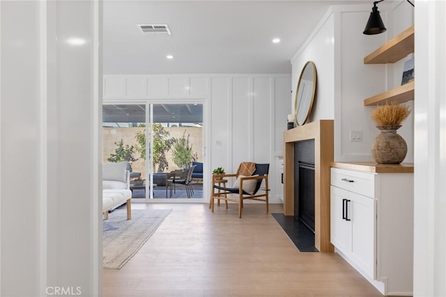 sitting room featuring light hardwood / wood-style flooring