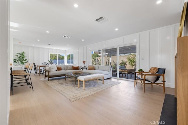 living room with light hardwood / wood-style floors