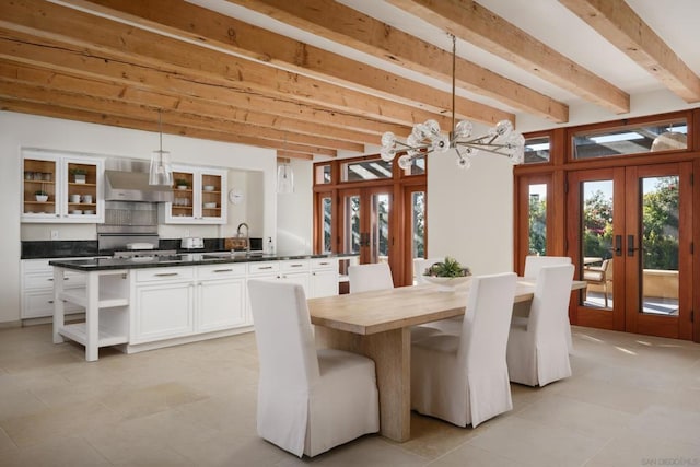 unfurnished dining area with beamed ceiling, sink, a notable chandelier, and french doors