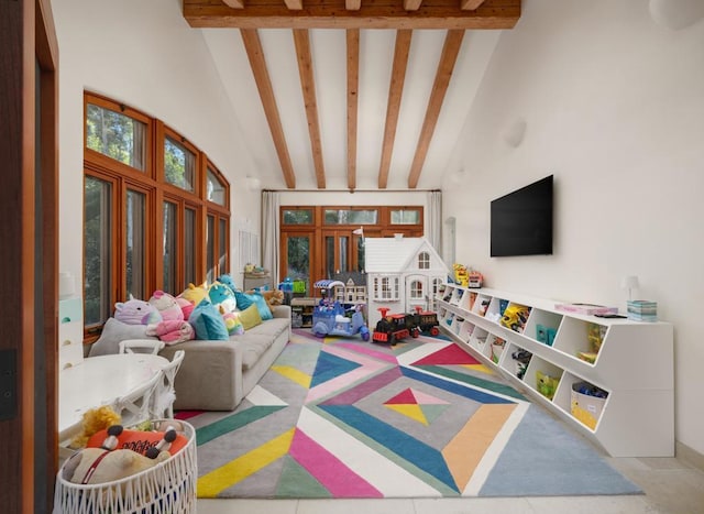 game room with beam ceiling and high vaulted ceiling