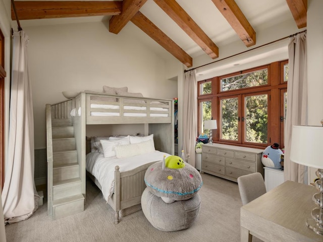 carpeted bedroom featuring lofted ceiling with beams