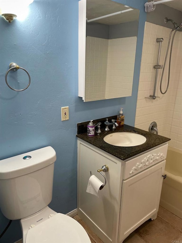 full bathroom with vanity, tiled shower / bath, tile patterned floors, and toilet