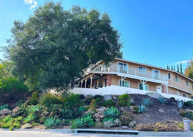 view of front of property with a balcony