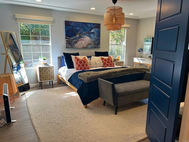 bedroom with hardwood / wood-style flooring