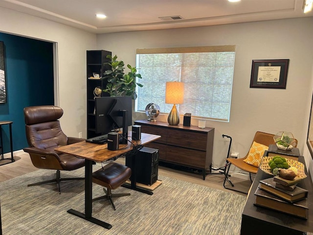 office space with light hardwood / wood-style floors